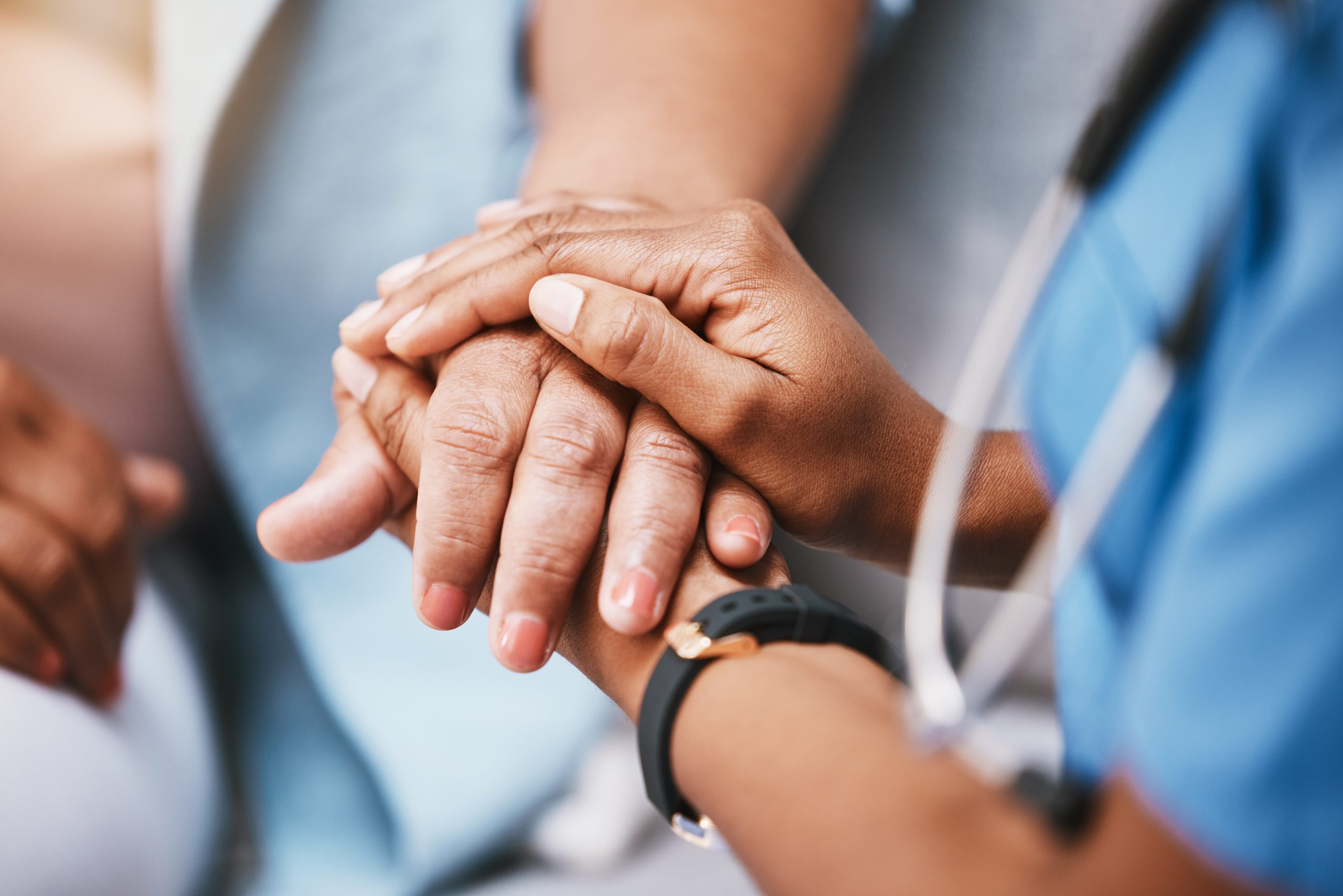 Empathy, trust and nurse holding hands with patient for help, support and support and healthcare ad.